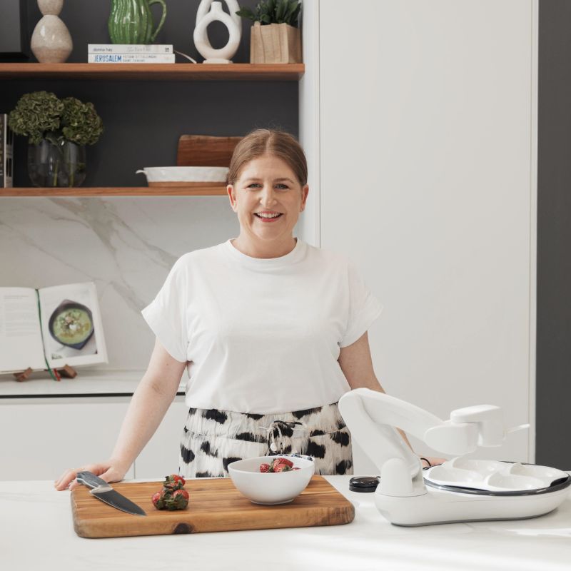 Amy from The Therapy Collective in the kitchen demonstrating the Obi Dining Robot