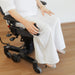 Person using VELA Power Wheels feature on VELA Tango 700E Activity Chair